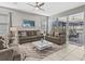 Living area with sliding doors leading to the pool area at 1808 Sandy Park Trl, Kissimmee, FL 34747