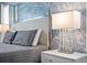 Close up of a nightstand with lamp in a bedroom at 1808 Sandy Park Trl, Kissimmee, FL 34747