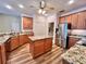 Island kitchen with granite countertops and stainless steel appliances at 209 Wekiva Pointe Cir, Apopka, FL 32712