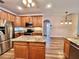 Spacious kitchen featuring granite island and breakfast bar at 209 Wekiva Pointe Cir, Apopka, FL 32712