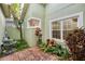 Private courtyard with brick pavers and lush landscaping at 2199 S Countryside Cir, Orlando, FL 32804