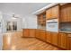 Kitchen with oak cabinets, granite countertops and wood floors at 2199 S Countryside Cir, Orlando, FL 32804