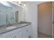 Bathroom with double vanity, granite countertop, and walk-in shower at 2229 Shadowland Loop, Winter Park, FL 32792