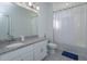 Bathroom with single vanity, granite countertop, and bathtub at 2229 Shadowland Loop, Winter Park, FL 32792