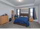 Bedroom with double bed, dresser, and access to a walk-in closet at 2229 Shadowland Loop, Winter Park, FL 32792