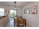 Casual dining area with sliding glass door access to backyard at 2229 Shadowland Loop, Winter Park, FL 32792
