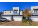 Modern two-story townhome with two-car garage and landscaped front yard at 2229 Shadowland Loop, Winter Park, FL 32792