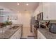 Modern kitchen featuring granite countertops and island with seating at 2229 Shadowland Loop, Winter Park, FL 32792