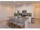 Spacious kitchen with granite countertops and stainless steel appliances at 2229 Shadowland Loop, Winter Park, FL 32792