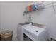 Laundry room with washer, dryer, and shelving at 2229 Shadowland Loop, Winter Park, FL 32792
