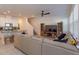 Open living area with sectional sofa, and kitchen island view at 2229 Shadowland Loop, Winter Park, FL 32792