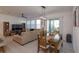 Open living room with large sectional sofa and entertainment center at 2229 Shadowland Loop, Winter Park, FL 32792