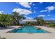 Community pool with lounge chairs and covered seating at 2229 Shadowland Loop, Winter Park, FL 32792