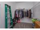 Spacious walk-in closet with clothing and shelving at 2229 Shadowland Loop, Winter Park, FL 32792
