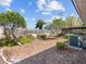 Wide angle backyard shot with a wooden fence, trees, and landscaping at 2459 Hunterfield Rd, Maitland, FL 32751