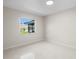 Cozy bedroom with bright light from the window, and neutral wall and floor at 2459 Hunterfield Rd, Maitland, FL 32751