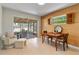 Dining room with outdoor access, featuring neutral tones and view to a screened lanai at 2459 Hunterfield Rd, Maitland, FL 32751