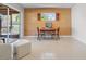 Bright dining area with sliding glass doors, natural textures, and outdoor views at 2459 Hunterfield Rd, Maitland, FL 32751