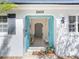 Inviting front entrance featuring a vibrant blue door and an open foyer, providing a warm welcome at 2459 Hunterfield Rd, Maitland, FL 32751