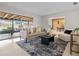Bright living room with patio access and an open view to the dining space at 2459 Hunterfield Rd, Maitland, FL 32751