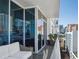 Spacious condo balcony offering a relaxing seating area and stunning city views from its elevated vantage point at 260 S Osceola Ave # 1001, Orlando, FL 32801