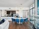 Modern dining area and kitchen with sleek design and hardwood floors at 260 S Osceola Ave # 1001, Orlando, FL 32801