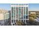 Beautiful exterior shot of a modern high-rise building with unique blue glass windows and balconies at 260 S Osceola Ave # 1001, Orlando, FL 32801