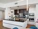 Modern kitchen featuring a large island, stainless steel appliances, and sleek cabinetry at 260 S Osceola Ave # 1001, Orlando, FL 32801