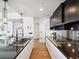 Contemporary kitchen with custom cabinetry, an eat-in island, and high-end appliances at 260 S Osceola Ave # 1001, Orlando, FL 32801