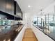 Modern kitchen featuring sleek cabinetry, a spacious island with high-end appliances, and stylish fixtures at 260 S Osceola Ave # 1001, Orlando, FL 32801