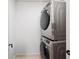 This laundry room features a modern, stacked washer and dryer set at 260 S Osceola Ave # 1001, Orlando, FL 32801