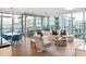 Open living and dining area with floor-to-ceiling windows at 260 S Osceola Ave # 1001, Orlando, FL 32801