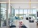 Bright living room with floor-to-ceiling windows and a stylish bar area, creating an inviting atmosphere at 260 S Osceola Ave # 1001, Orlando, FL 32801