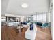 Open living space with kitchen and dining area, hardwood floors at 260 S Osceola Ave # 1001, Orlando, FL 32801