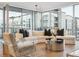 Living room with floor-to-ceiling windows and modern decor at 260 S Osceola Ave # 1001, Orlando, FL 32801