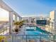 Rooftop pool deck with city views, palm trees, and inviting lounge seating at 260 S Osceola Ave # 1001, Orlando, FL 32801