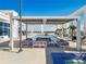 Rooftop pool deck with modern lounge seating, shade cover, palm trees, and panoramic views at 260 S Osceola Ave # 1001, Orlando, FL 32801