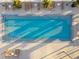 Aerial view of pool with cool, turquoise water, surrounded by lounge chairs at 260 S Osceola Ave # 1001, Orlando, FL 32801