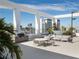 Relaxing rooftop deck with outdoor kitchen, dining, seating area, and stunning city views at 260 S Osceola Ave # 1001, Orlando, FL 32801