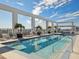 Stunning rooftop pool with lounge chairs, palm trees, city views, and ample space for relaxation at 260 S Osceola Ave # 1001, Orlando, FL 32801