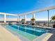Gorgeous rooftop pool with lounge seating, landscaping, and panoramic skyline views at 260 S Osceola Ave # 1001, Orlando, FL 32801