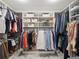 Well-organized walk-in closet with shelving, hanging rods, and ample space for storage and accessories at 260 S Osceola Ave # 1001, Orlando, FL 32801