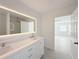 Modern bathroom with double vanity and walk-in shower at 2827 Sanctuary Ln, Winter Garden, FL 34787