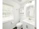 Bright bathroom with white vanity, toilet, and shower at 2827 Sanctuary Ln, Winter Garden, FL 34787