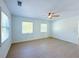 Spacious bedroom with two windows and ceiling fan at 2827 Sanctuary Ln, Winter Garden, FL 34787