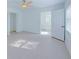 Bright bedroom with light wood flooring and ceiling fan at 2827 Sanctuary Ln, Winter Garden, FL 34787