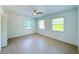 Spacious bedroom with two windows and ceiling fan at 2827 Sanctuary Ln, Winter Garden, FL 34787