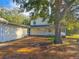 Two-story house with a porch and American flag at 2827 Sanctuary Ln, Winter Garden, FL 34787