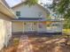 Two-story house exterior with a wraparound porch at 2827 Sanctuary Ln, Winter Garden, FL 34787