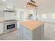 Modern kitchen features a butcher block island and stainless steel appliances at 2827 Sanctuary Ln, Winter Garden, FL 34787